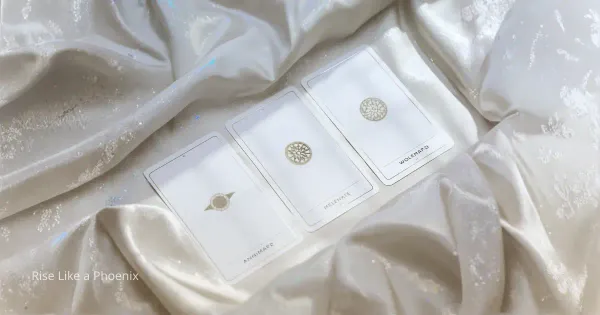 Tarot cards on a soft neutral surface, representing quiet reflection and personal inquiry.