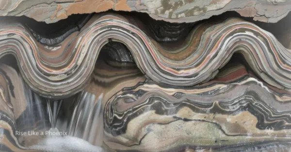 Layered rock formation with flowing water symbolizing structure, conditioning, and individual response.